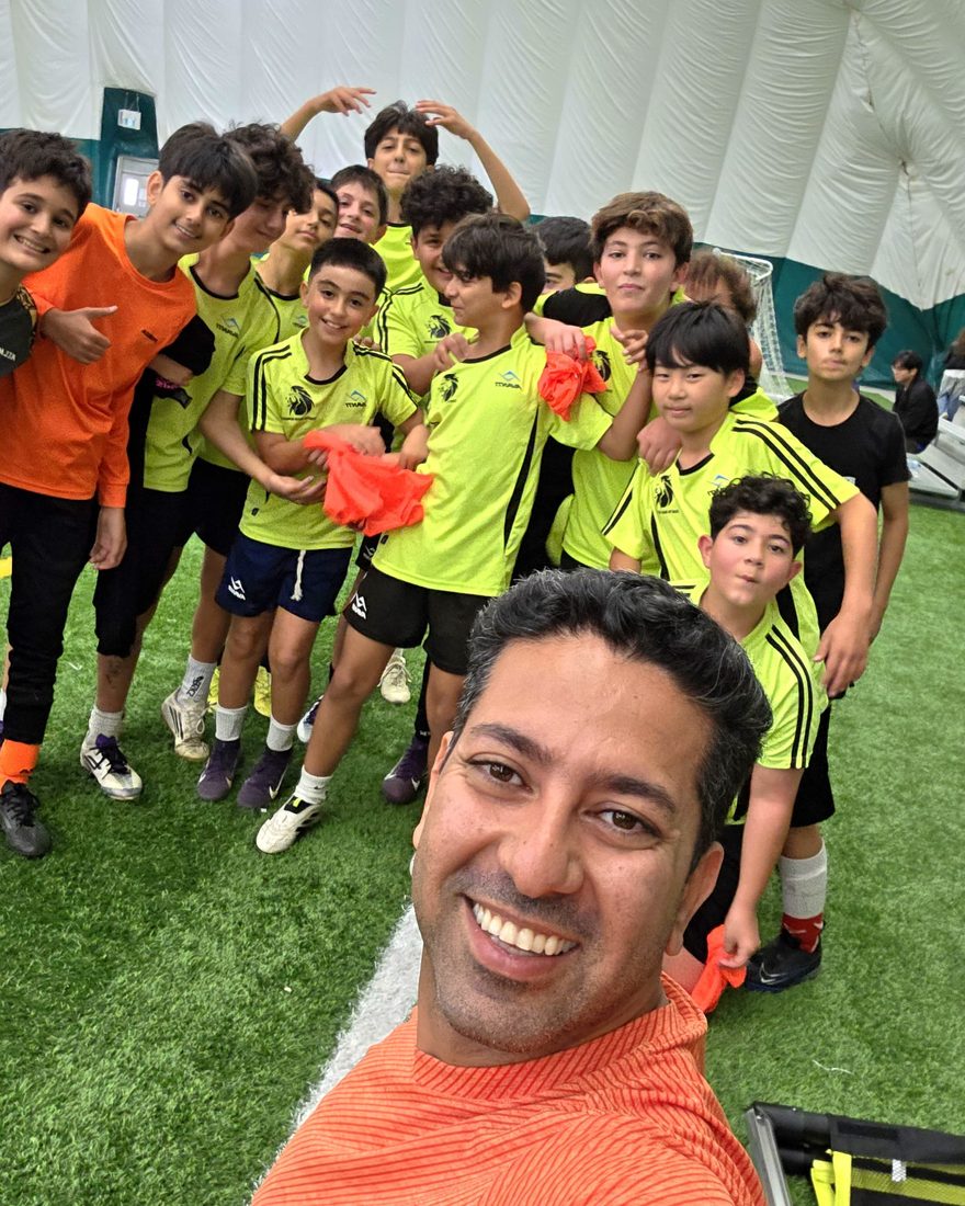 Coach Reza with his team at an indoor dome session